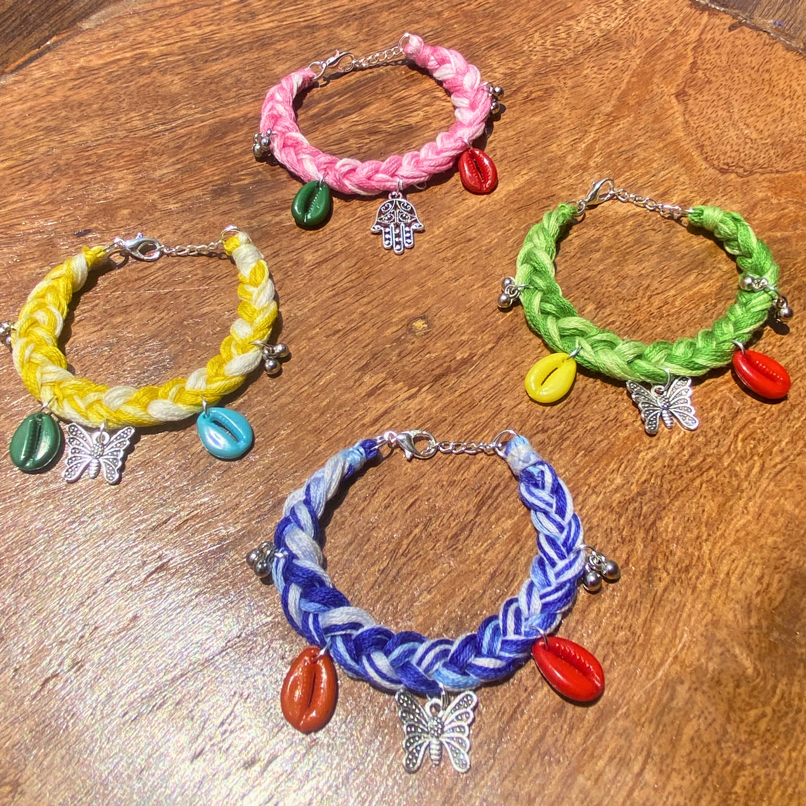 Handmade boho bracelet set of 4 multicolor pink yellow green blue cowrie shell charm by SauGaat Handmade Uttarakhand