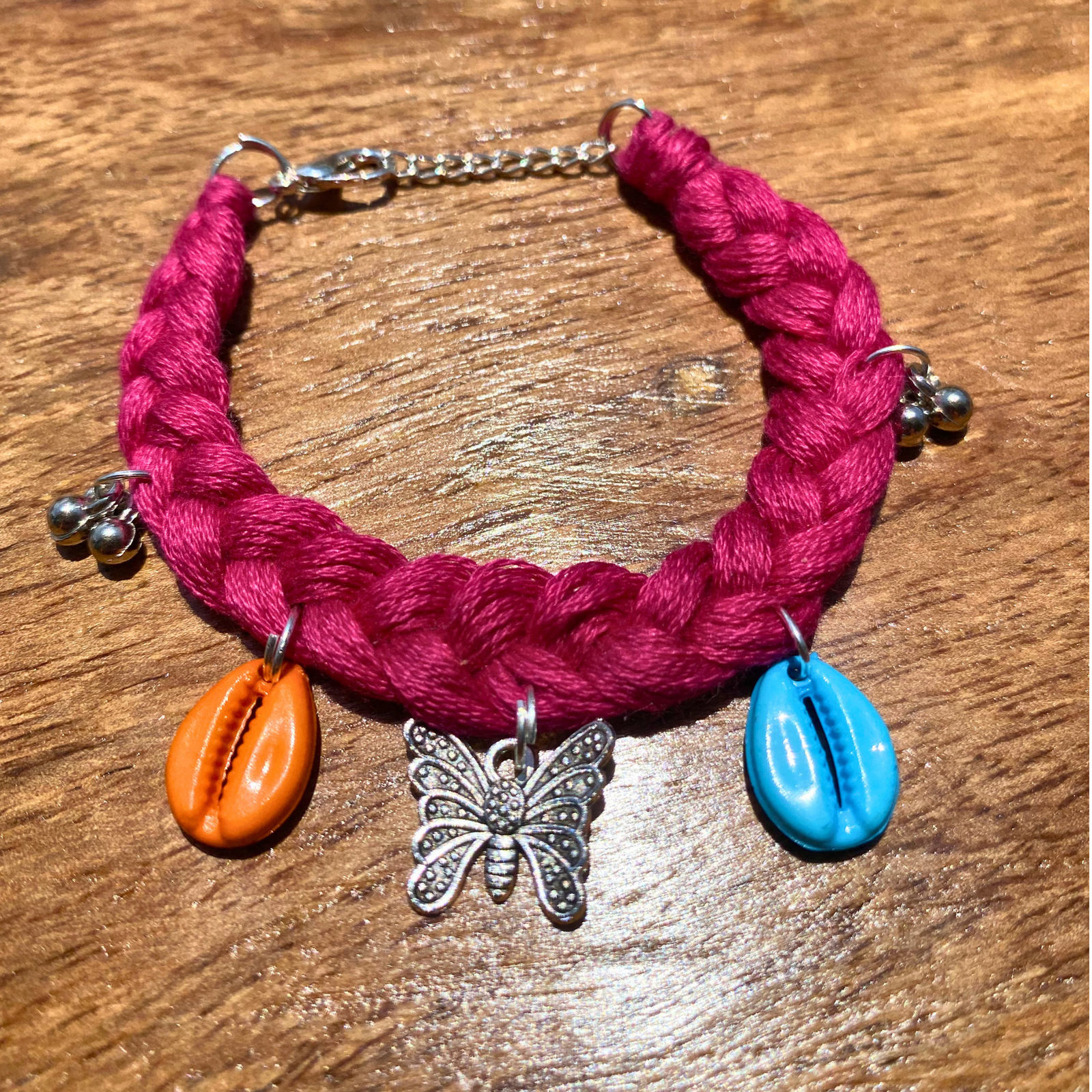 Handmade boho bracelet magenta cowrie shell butterfly charm SauGaat Uttarakhand
