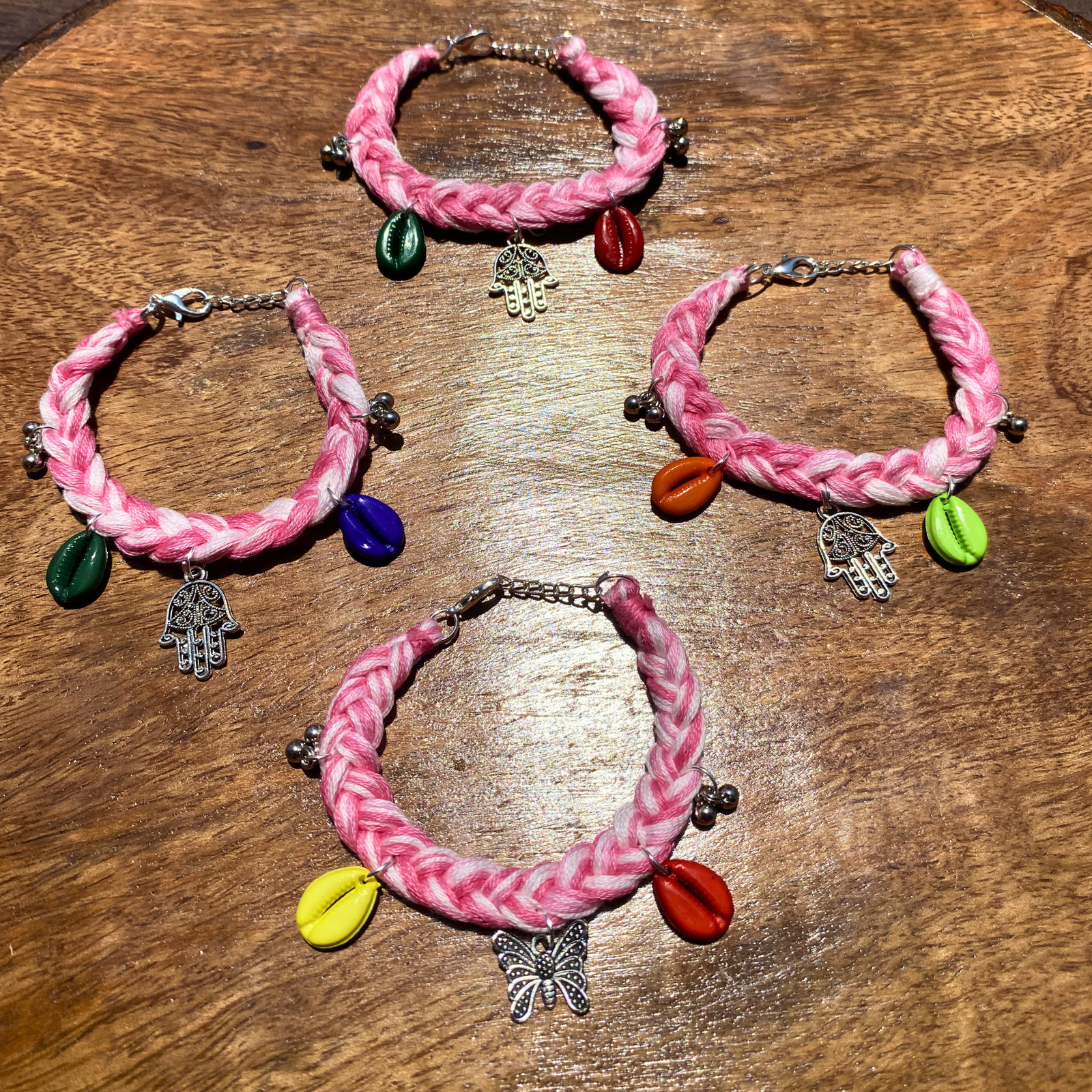 Handmade boho bracelet set of 4 baby pink cotton thread cowrie shell charm by SauGaat Handmade Uttarakhand